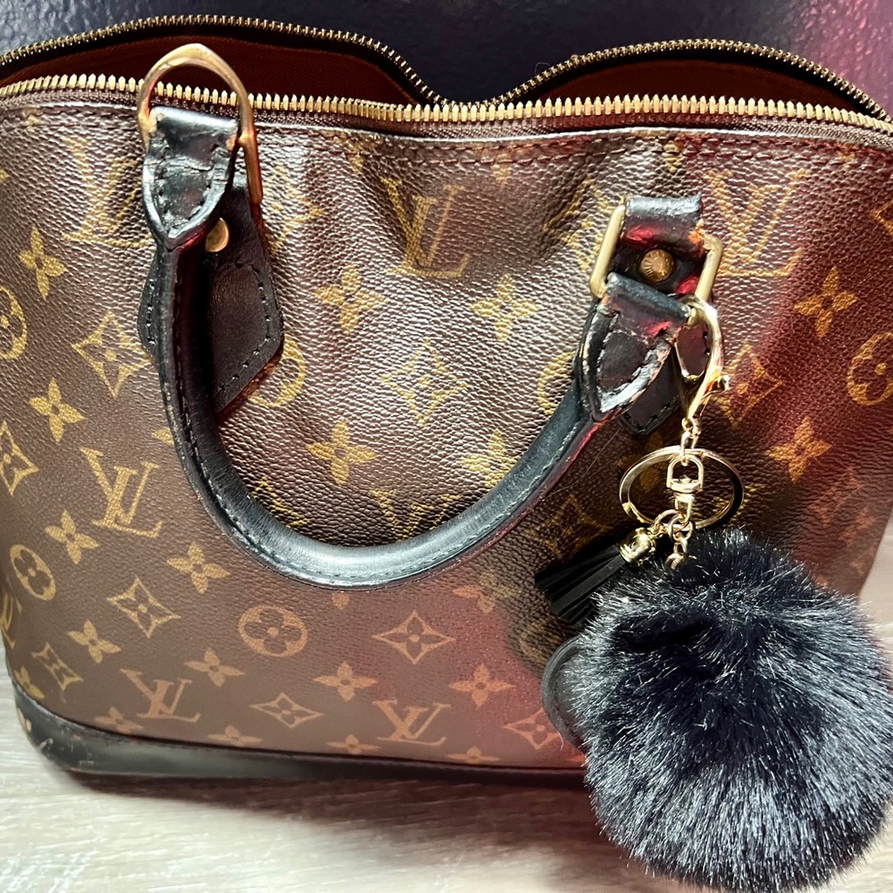 Louis Vuitton Monogram Handbag with Black Pom Pom